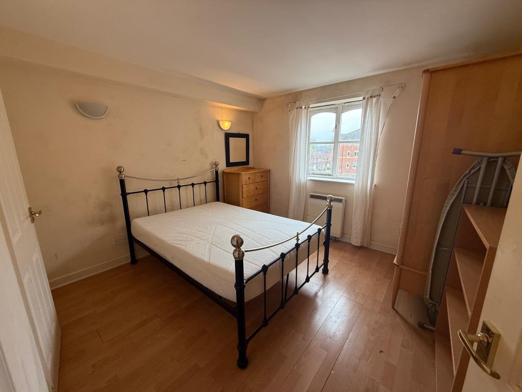 Lot: 179 - TWO-BEDROOM FLAT IN NEED OF IMPROVEMENT - Double bedroom with door to en-suite